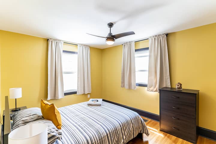 Master bedroom (bedroom 1) - equipped with 1 queen bed (sleeps 2 adults), 1 Portable single bed (sleeps 1 adult), and a 50-inch Roku TV.