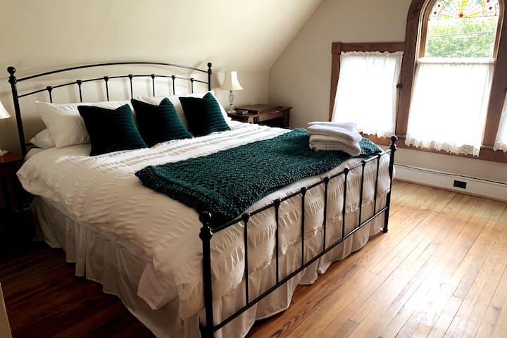 Third floor master bedroom with king sized bed.