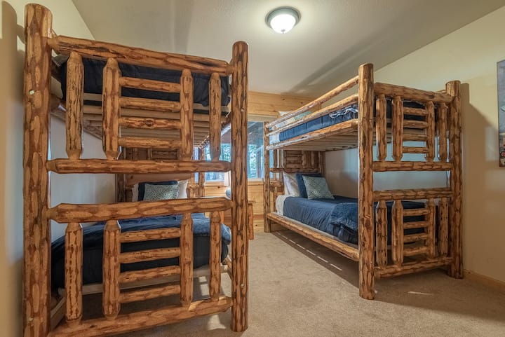 Bunk room on lower floor with two sets of twin XL bunkbeds. 
