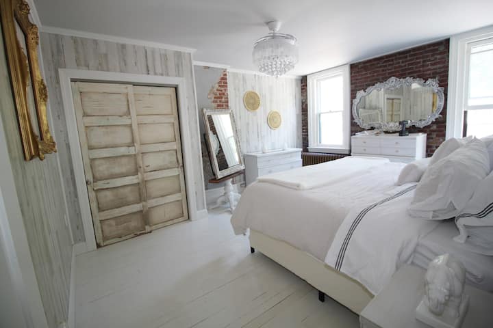 Who wouldn't want to sleep in this master bedroom?  Every single element was custom designed, except for the funky modern ceiling fan. The blades expand & retract and it becomes a ceiling fan! The remote is on the wall.