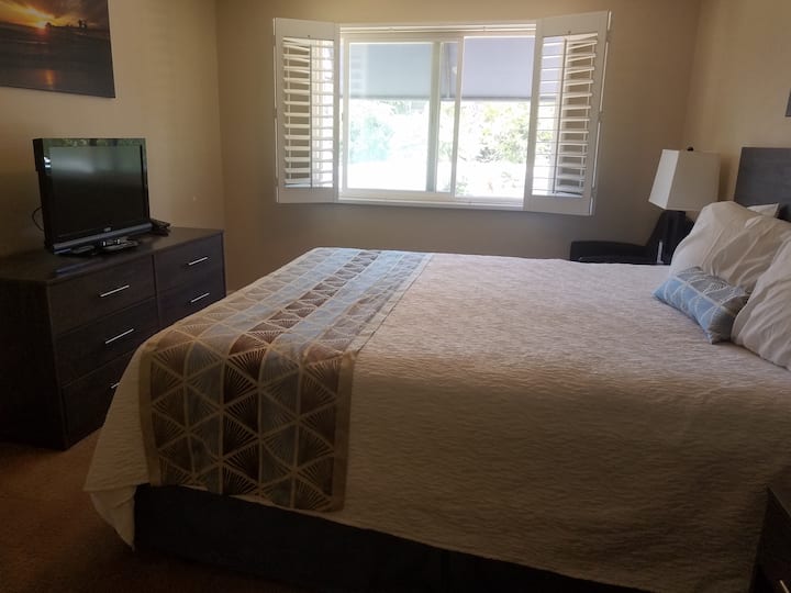 Bedroom 1 - King Bed, TV, shelves, closets