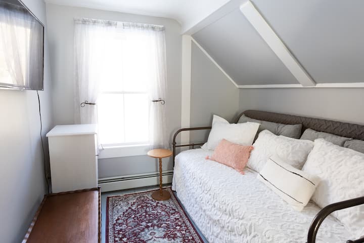 A bonus sitting room with a Roku smart TV also offers a twin size daybed for flexible sleeping options.
