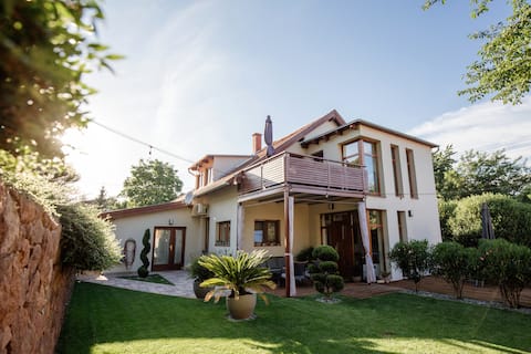 Quiet Garden Wellness Apartments / Grand