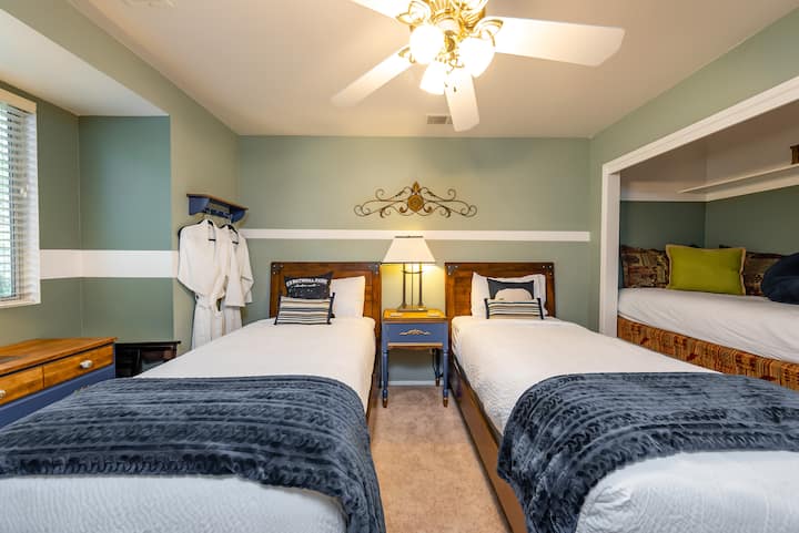 Three Rivers - Bedroom #7  Three twin beds total.   Do you see the one twin that all the kids want to sleep in?  Built in to the wall like cubby.