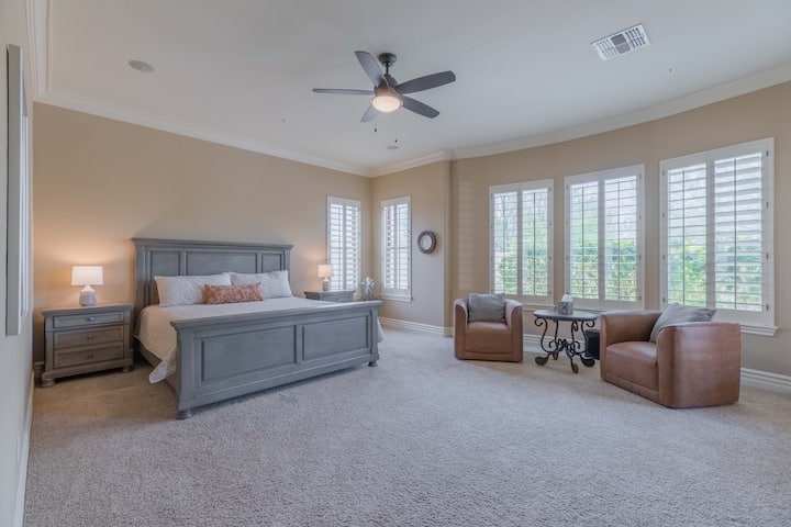Primary Bedroom with direct access to the pool and hot tub.