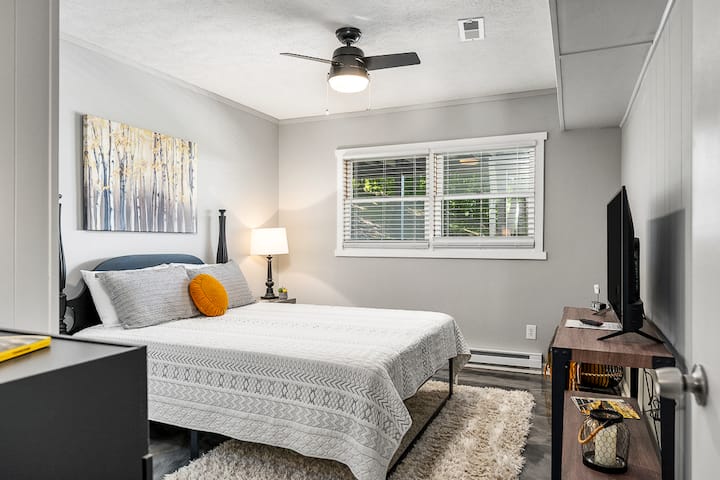 The second bedroom, located on the lower level, features a comfy queen sized bed and a fully loaded TV.  