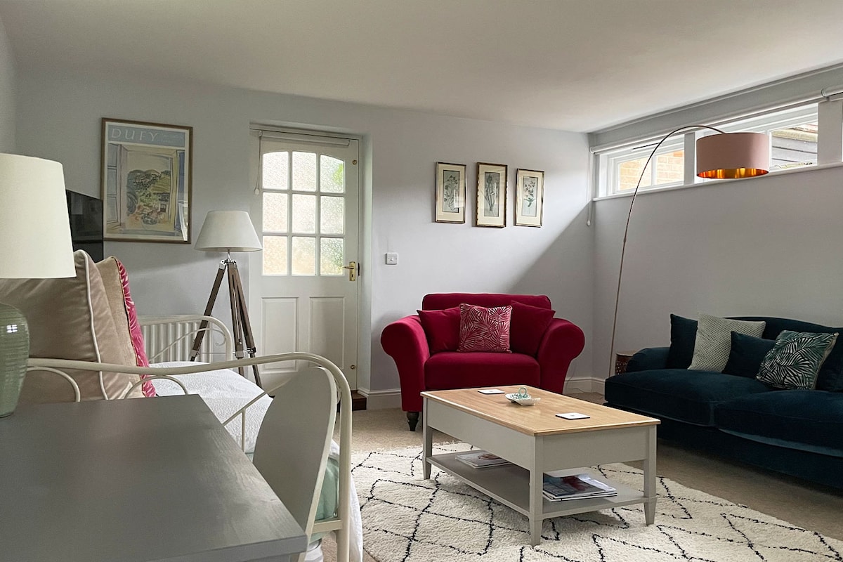 The sitting room has style, comfort and plenty of space for relaxing and sleeping.