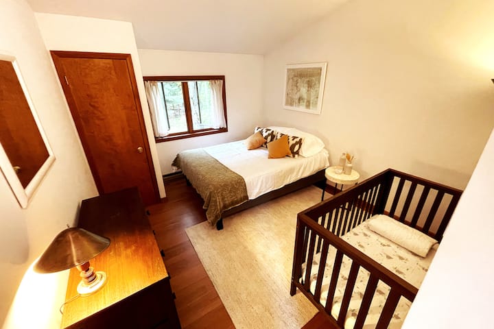 Bedroom one, with a queen sized bed and a crib for the little one. 