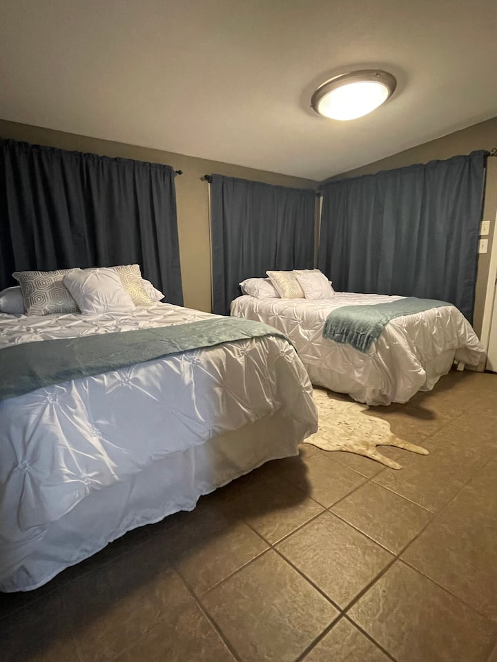 Two double size beds with a private access door.