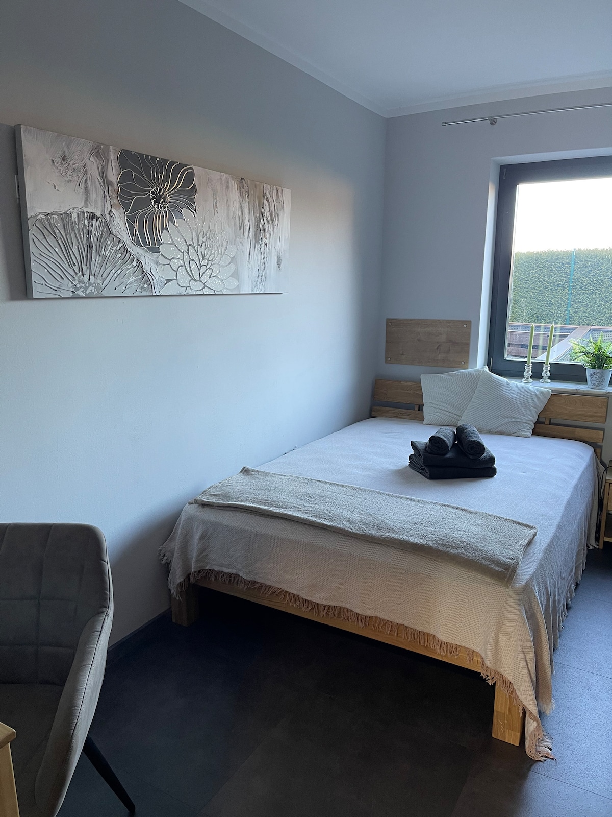 Bedroom No. 1 with king-size bed, TV and desk.