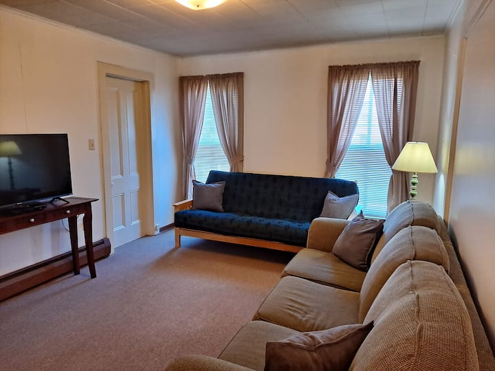 Living Room has a standard sofa, fold-out futon and desk workspace. Features a 43" Roku TV and DVD player as well as complimentary Wi-Fi throughout. Also games, books, puzzles, playing cards, and DVDs are tucked away in a little cubby closet.