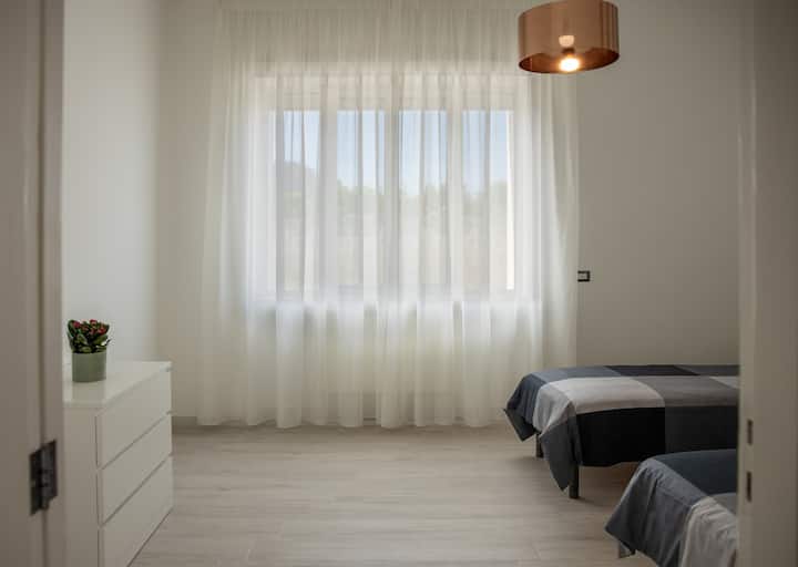 Bedroom with single, air-conditioned, north-facing bed. Beds can be joined upon request.