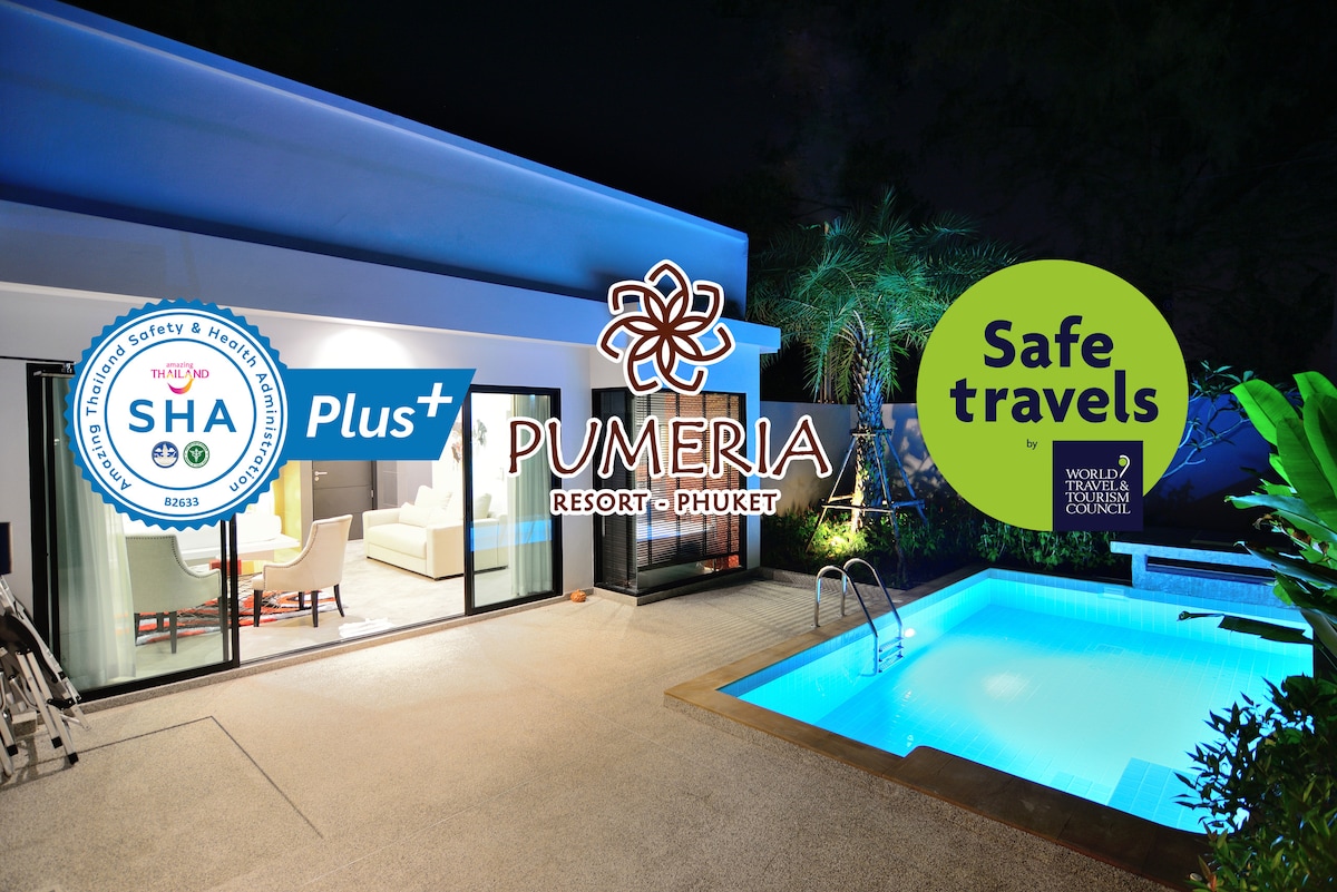 An evening view of a private pool suite reveals a comfortable seating area with light-colored furniture beside large glass doors. A small pool sparkles under soft lighting, surrounded by tropical plants. Safety and cleanliness certifications are prominently displayed.