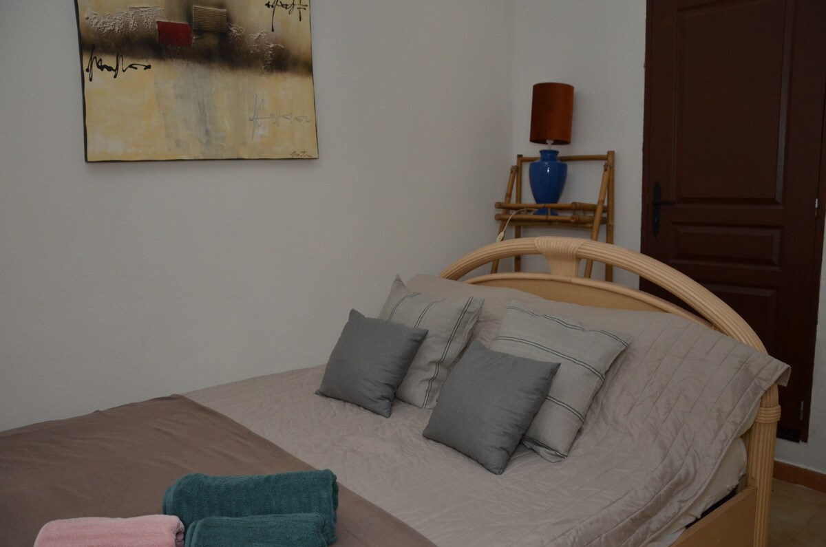 Large double bed with covered outdoor terrace access 