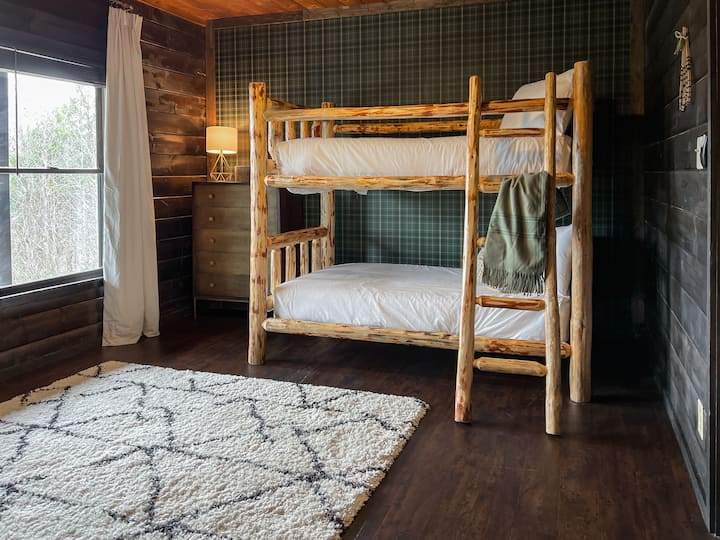 The basement bunkroom sleeps 4 with two sets of bunks and has an en suite bathroom. A favorite for the night owls in the group! 