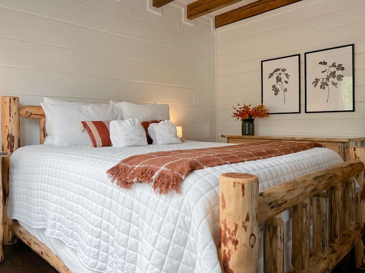 An additional queen bedroom is located on the main floor.