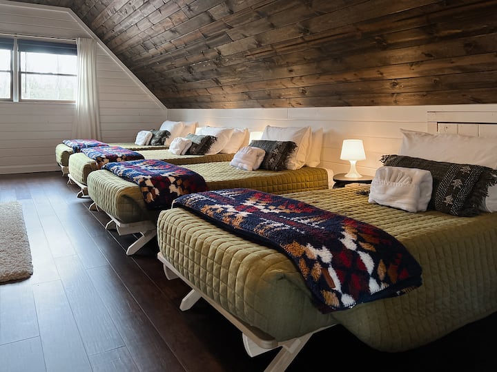 The Camp Room, accessible through the Primary Suite, is the perfect hideaway! Four twin beds that are perfect for the young, or young at heart!