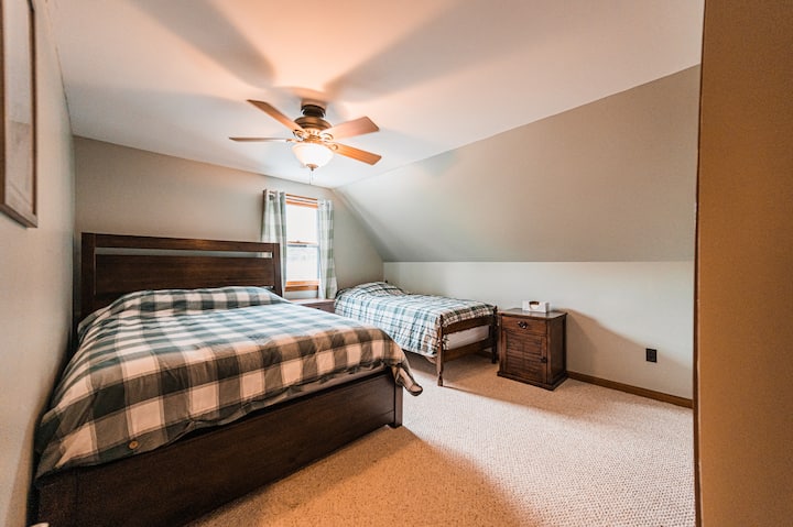 Second floor bedroom with queen and twin beds
