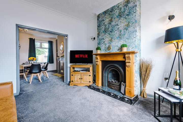 The spacious living room boasting a comfortable double sofa bed, 40-inch Smart TV with Netflix and plenty of space to sit down in the evenings.