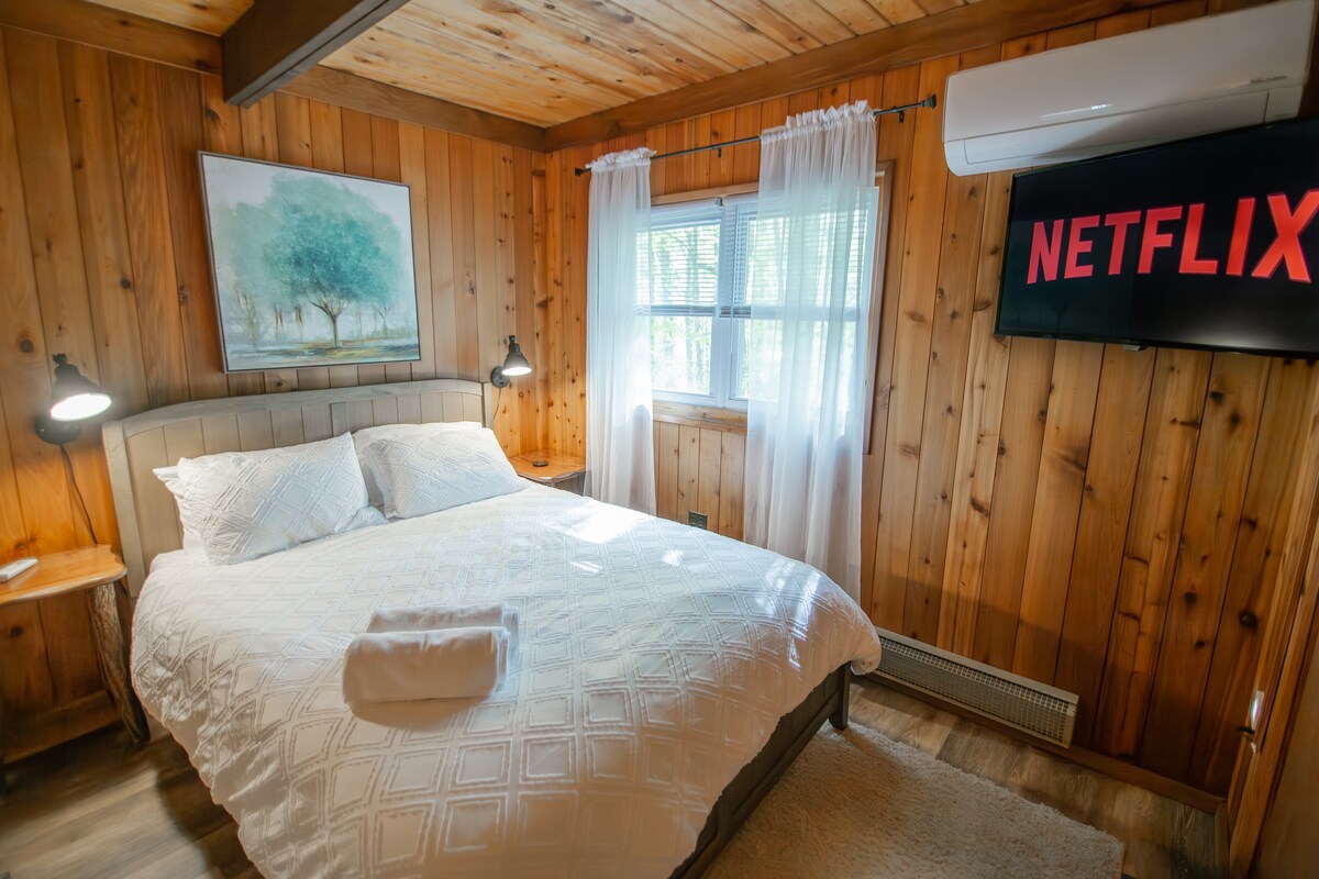 Wind down in this cozy full bedroom, featuring a smart TV so you can stream your favorite shows and movies. It’s the perfect spot to relax, binge, and recharge after a day outdoors.
