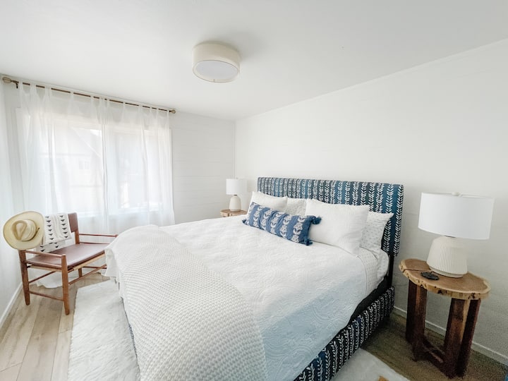 This is one of two bedrooms on the first floor. Complete with a king-size bed, plenty of storage in the closet with shelves, and hanging space. Hangers and luggage rack provided.