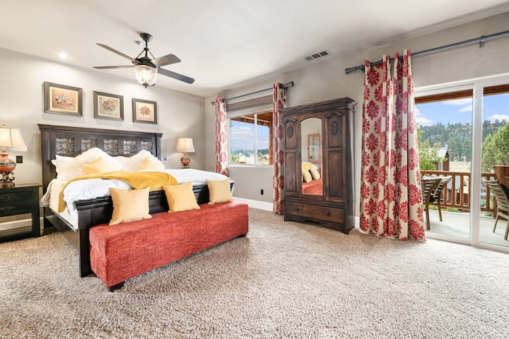 Bedroom #6 is an upstairs master suite featuring a luxurious king bed, stunning mountain views, and an ensuite bathroom. Spacious and serene, it's the perfect retreat in Big Bear Castle for ultimate comfort and relaxation.