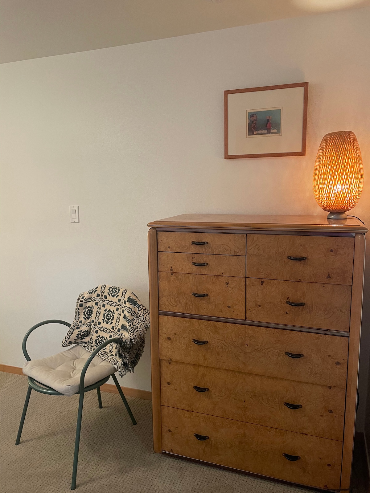 Antique maplewood chest of drawers in bedroom