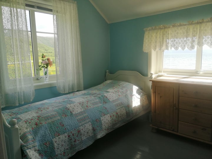 Bedroom with single bed and bunk bed.