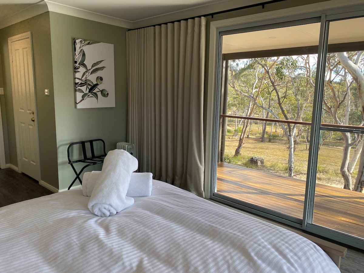 Bedroom one with outstanding bush views.