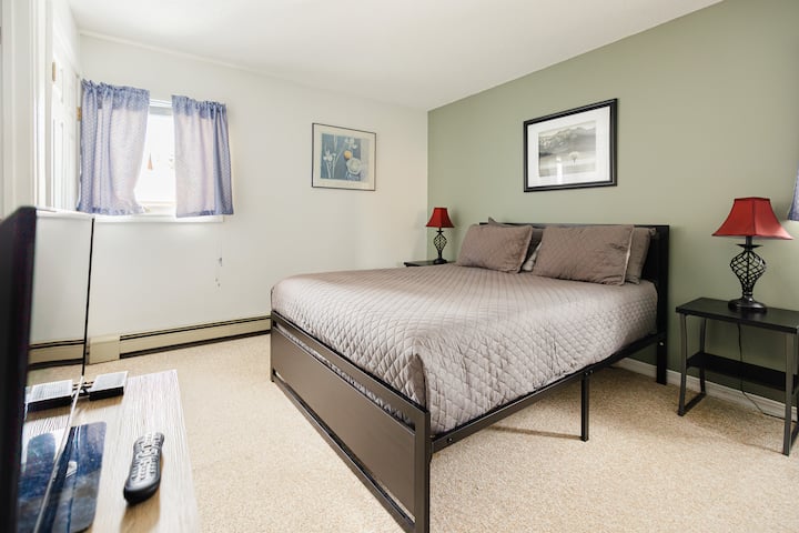 Bedroom 1: queen bed with attached bathroom
