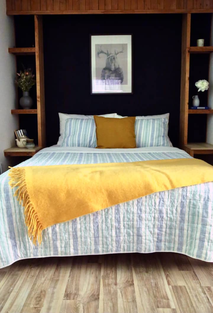 Second bedroom in the basement with queen size bed.
Second basement bedroom with a queen size bed.