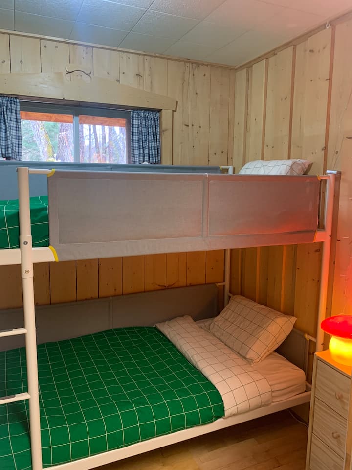 Children's room with single bunk beds.
Children's room with single bunk beds.
