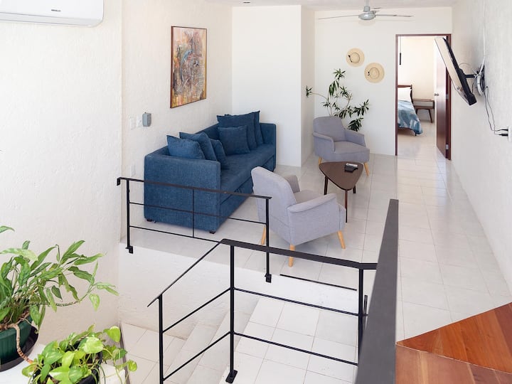 Spacious living room with comfortable sofa bed and Smart TV. Access to second bedroom and rooftop terrace.