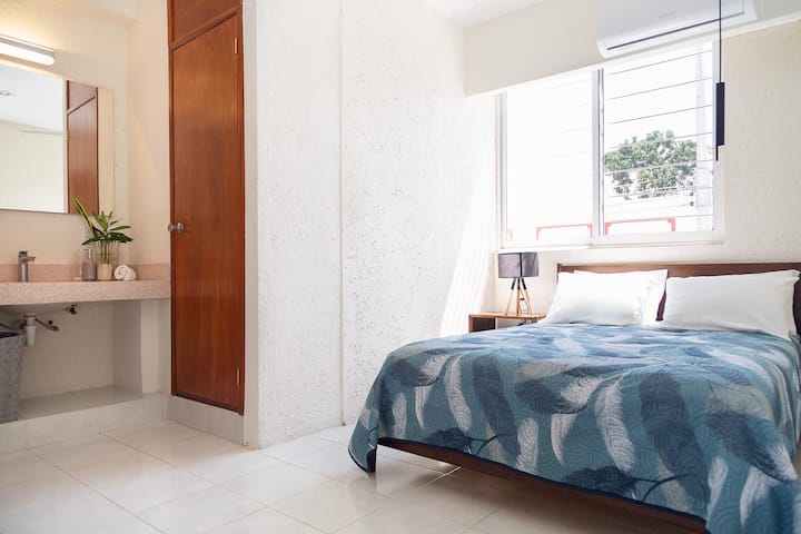 Second bedroom with double bed, full bathroom and closet.