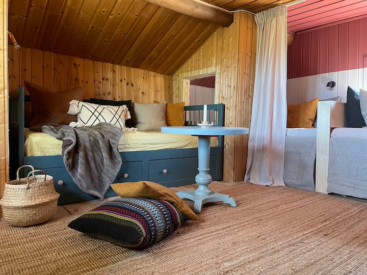 Upstairs with two built-in beds, sofa bed, TV and small desk