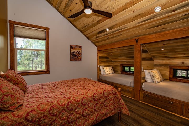 Second bedroom has double bed and two twin berths.  Ample closet space & storage.