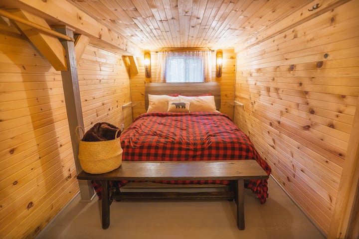 Queen size bed in our rustic bunkhouse. Comforters will be provided starting in Fall weather.