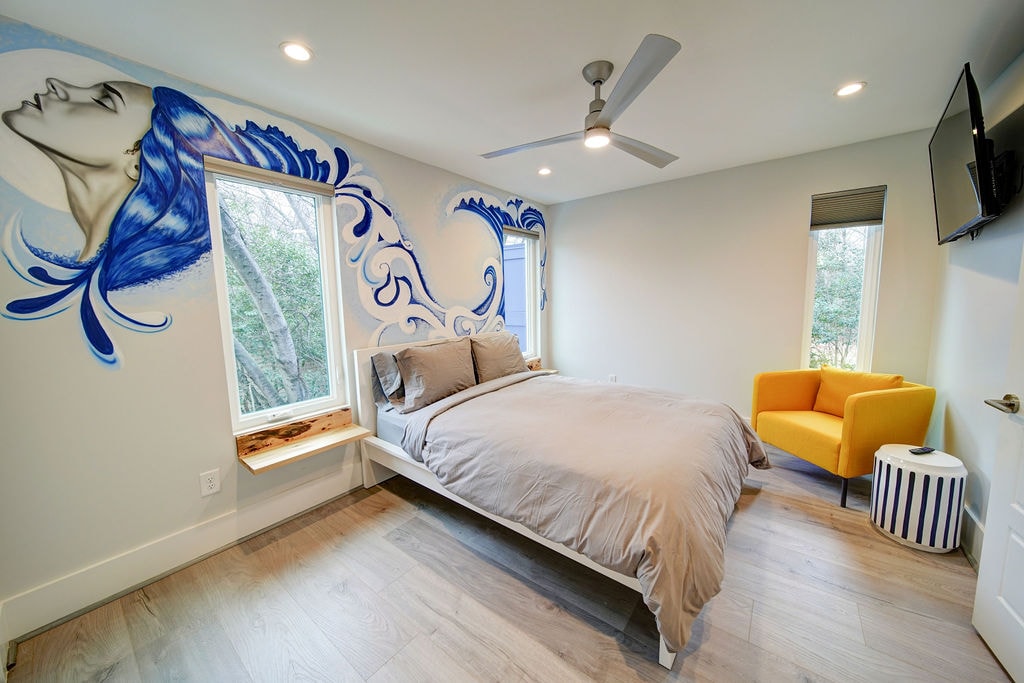Bedroom with custom wall art by local NODA artist 