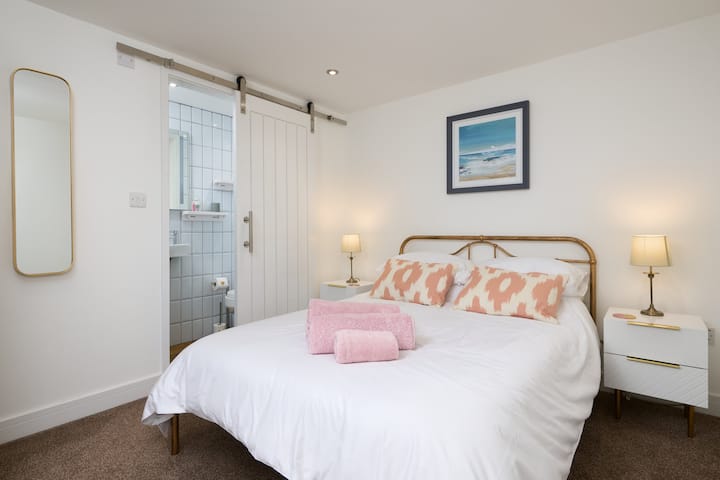 The first double bedroom with an en suite shower and toilet.