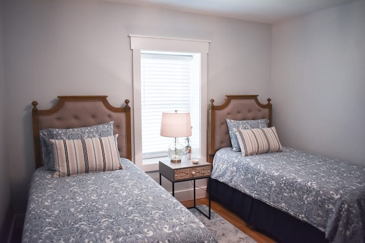 This bedroom provides guests with a large walk-in closet for storage. Both twin beds have new memory foam mattresses. 