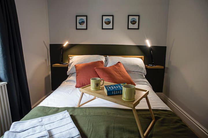 Cosy bed space with great lighting for reading.