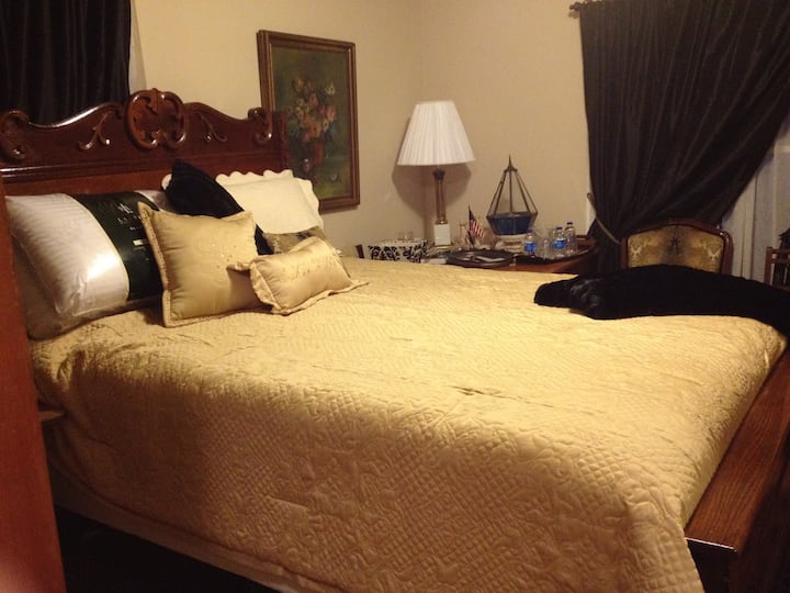 "Gold Room". queen bed.  private bath.  downstairs 