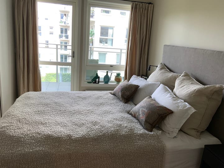 Master bedroom with exit to balcony.