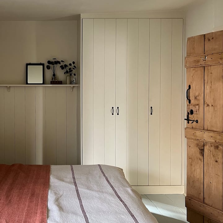 Master Bedroom with king size 'Emma' Mattress, blackout blinds and curtains. Hanging and shelf clothes storage