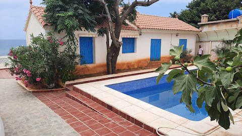 House on foot in the water with Pool