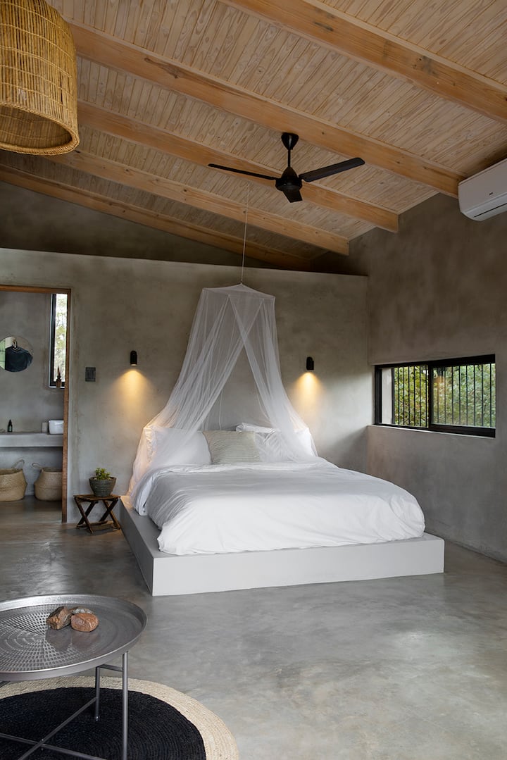 Studio extra length queen bed with mosquito net option.