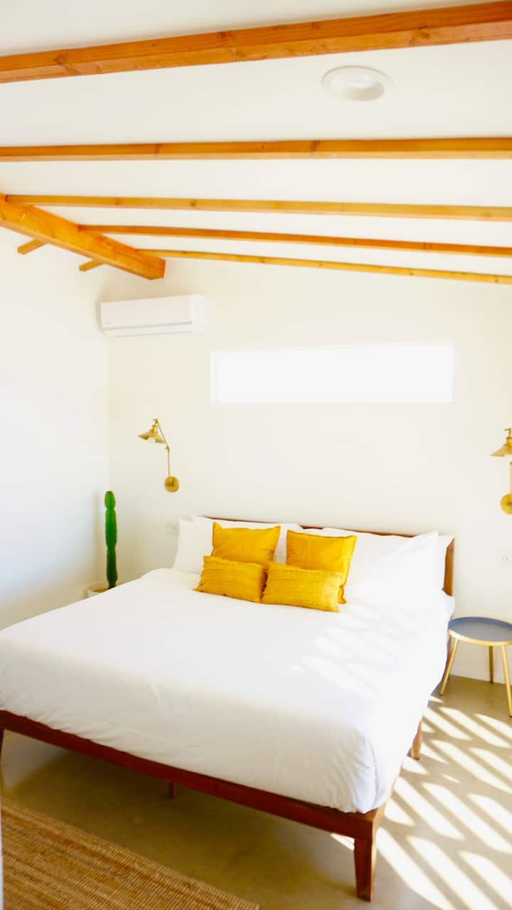 Bedroom #4 (king bed with en suite bathroom)  Sliding doors lead out to the back patio.