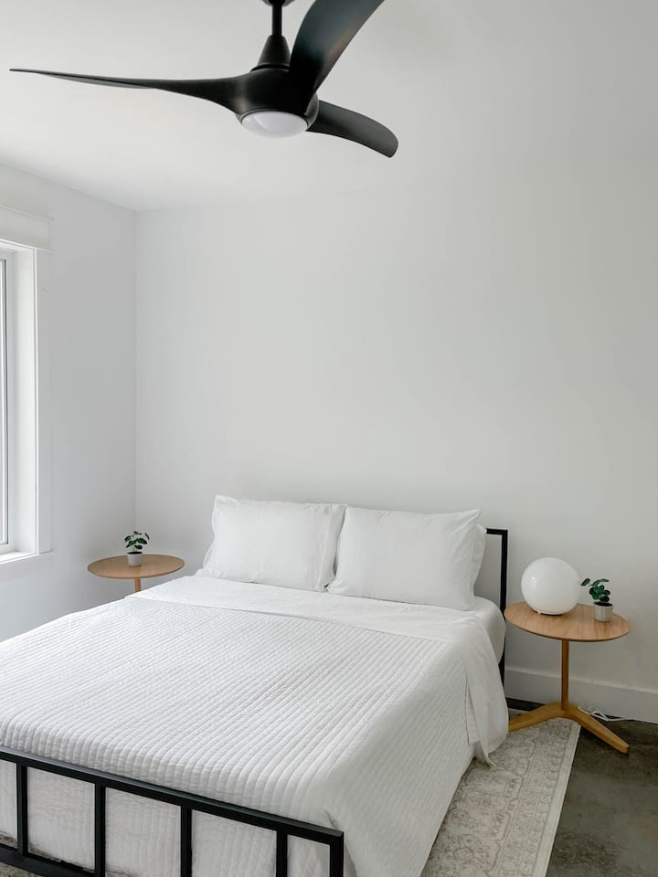 Our first bedroom features a queen-sized bed, bunk bed, large dresser and spacious closet.