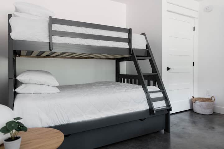 The bunk bed at Sagamore Reserve features the following mattress sizes: 
Top: Twin
Middle: Full
Bottom Trundle: Twin