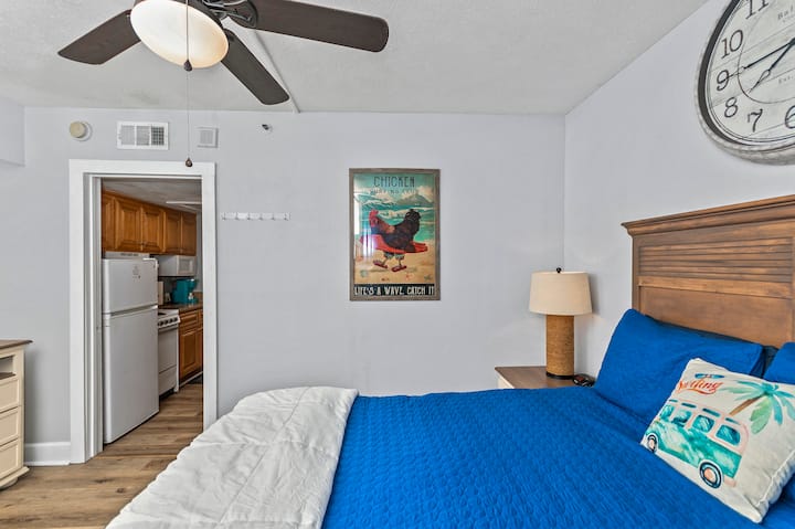 Queen bed, dresser, closet, mirror, large flat screen TV can be found in this room 